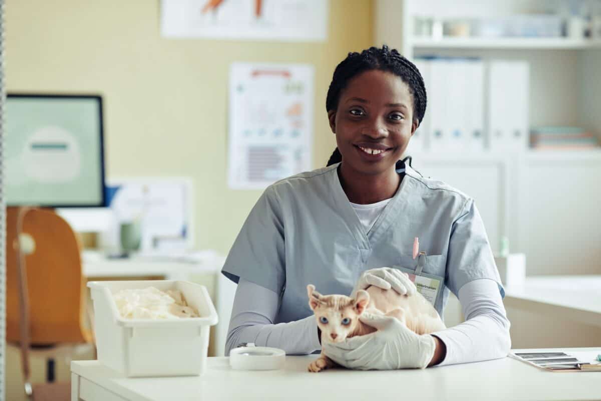 Smiling Veterinarian with Exotic Cat